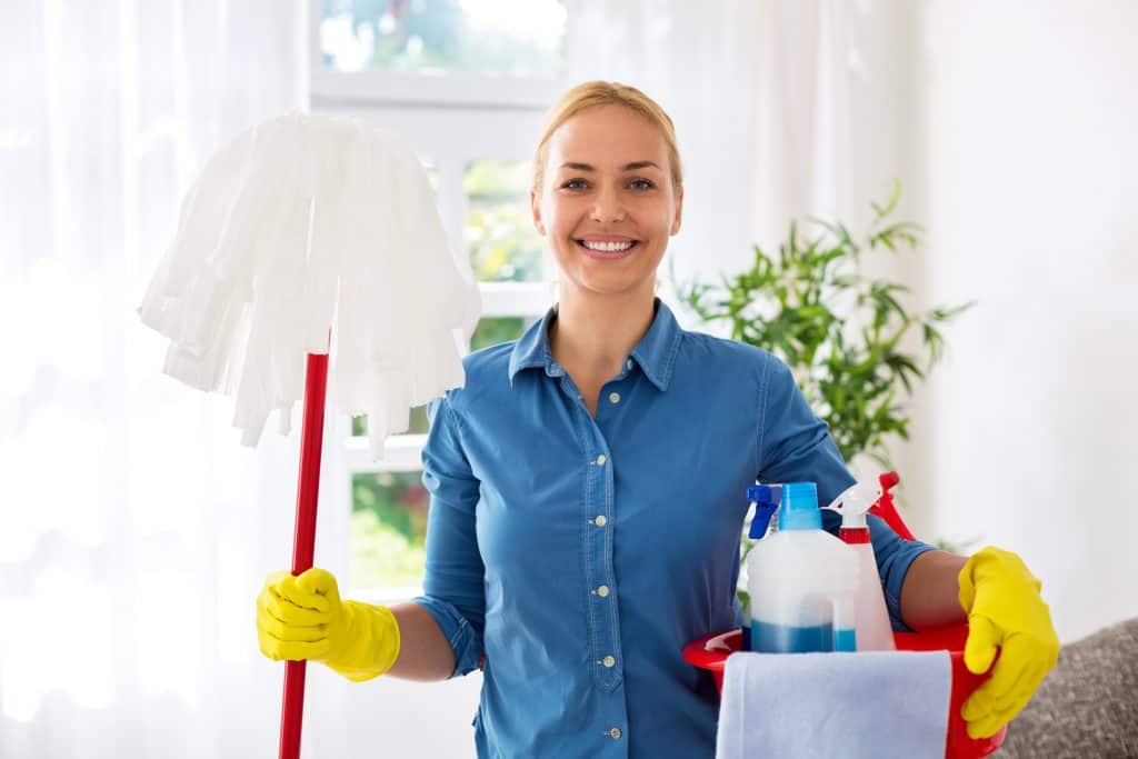 Smiling happy woman ready for cleaning home
