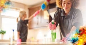 two women cleaning a kitchen