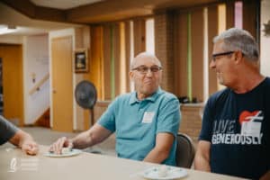 men talk to each other at respite care